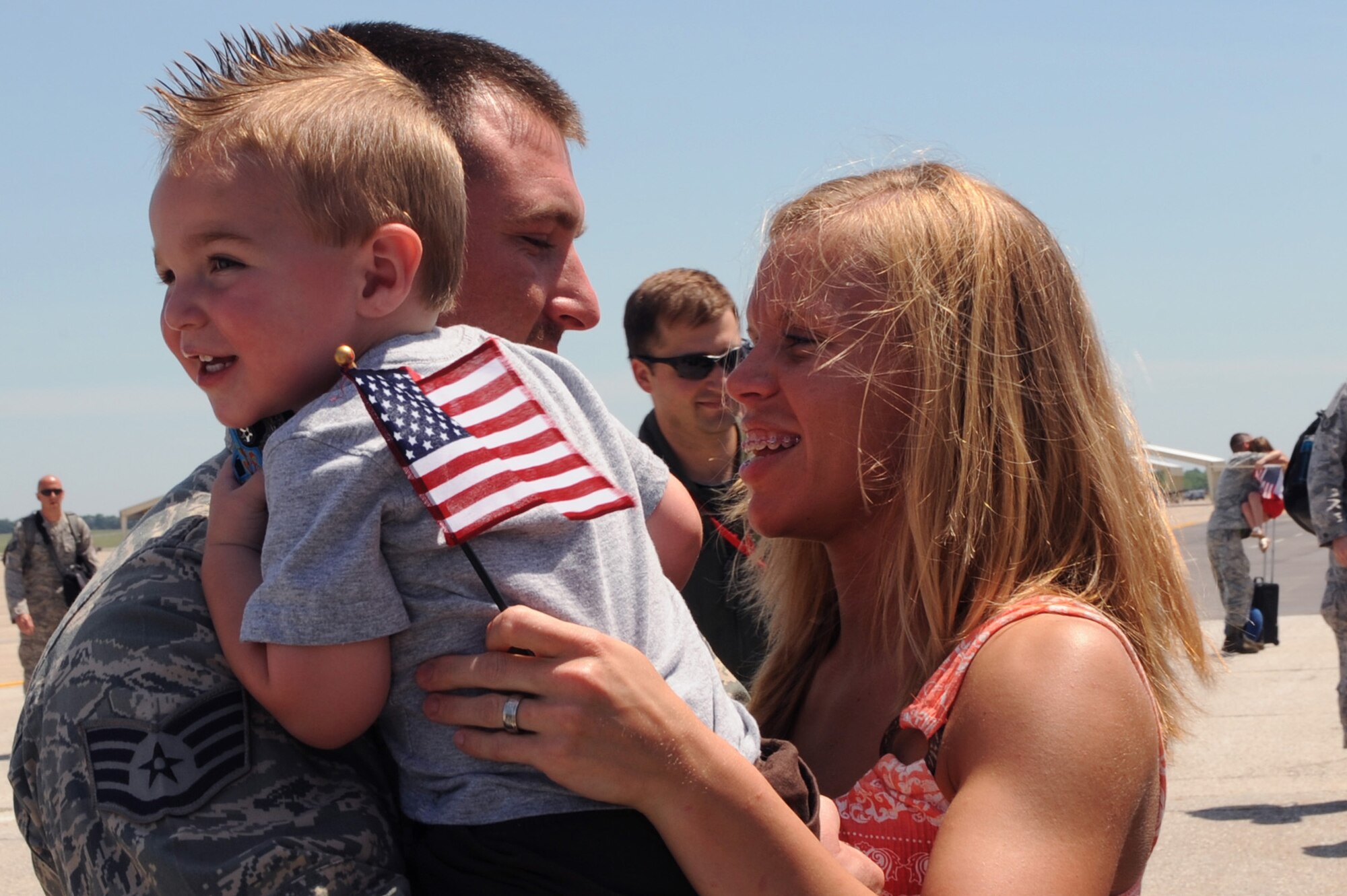 WHITEMAN AIR FORCE BASE, Mo., -- Staff Sgt. Walter Coston, 509th Aircraft Maintenance Squadron, embraces his wife Emerald, and son CJ, June 4, upon returning from a four-month deployment to Andersen Air Force Base. More than 200 Airmen deployed in support of the B-2 Spirit's continuing bomber presence in the Pacific.
(U.S. Air Force photo/Staff Sgt. Jason Huddleston)

