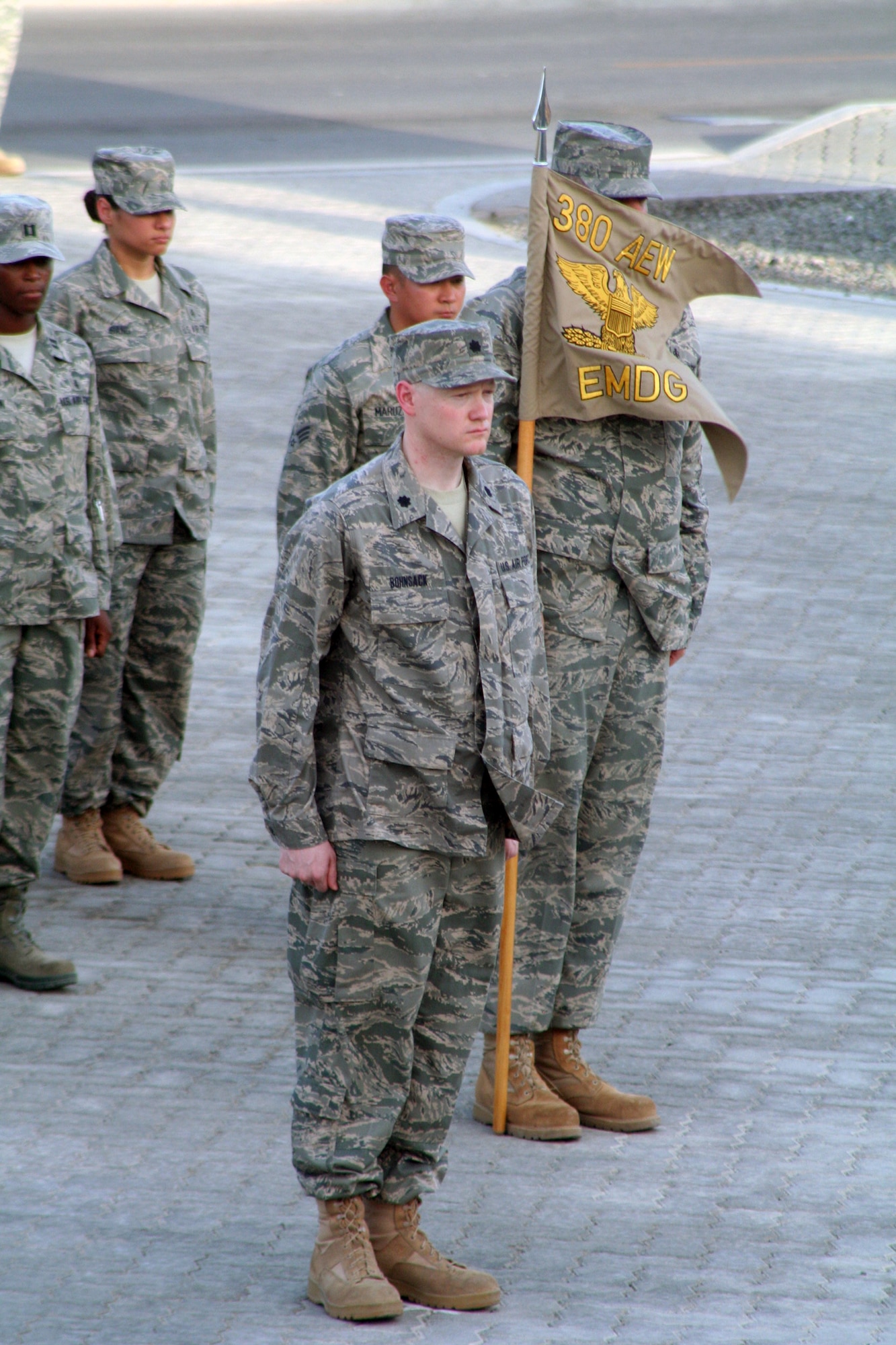 Lt. Col. Kevin Bohnsack of the 380th Expeditionary Medical Group leads Airmen from the 380th Air Expeditionary Wing during participation in a wing retreat ceremony on May 28, 2010, at a non-disclosed base in Southwest Asia. Every week the 380th AEW holds a retreat ceremony honoring the American flag as part of a continuing military tradition. On May 28, the 380th Expeditionary Medical Group served as the lead unit for the retreat. The 380th AEW supports operations Iraqi Freedom and Enduring Freedom and the Combined Joint Task Force-Horn of Africa. (U.S. Air Force Photo/Master Sgt. Scott T. Sturkol/Released)