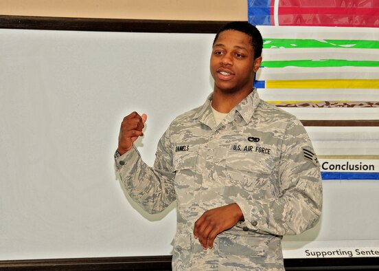 Rising Six member Senior Airman Elliott Hechabarria of the 914th Airlift Wing tells students of the Buffalo School of Technology about basic military training, June 8, 2010, Buffalo NY. As part of their community involvement members of the Rising Six talk to students on how the Air Force has made a positive change in their life. (U.S. Air Force photo by Staff Sgt. Joseph McKee)