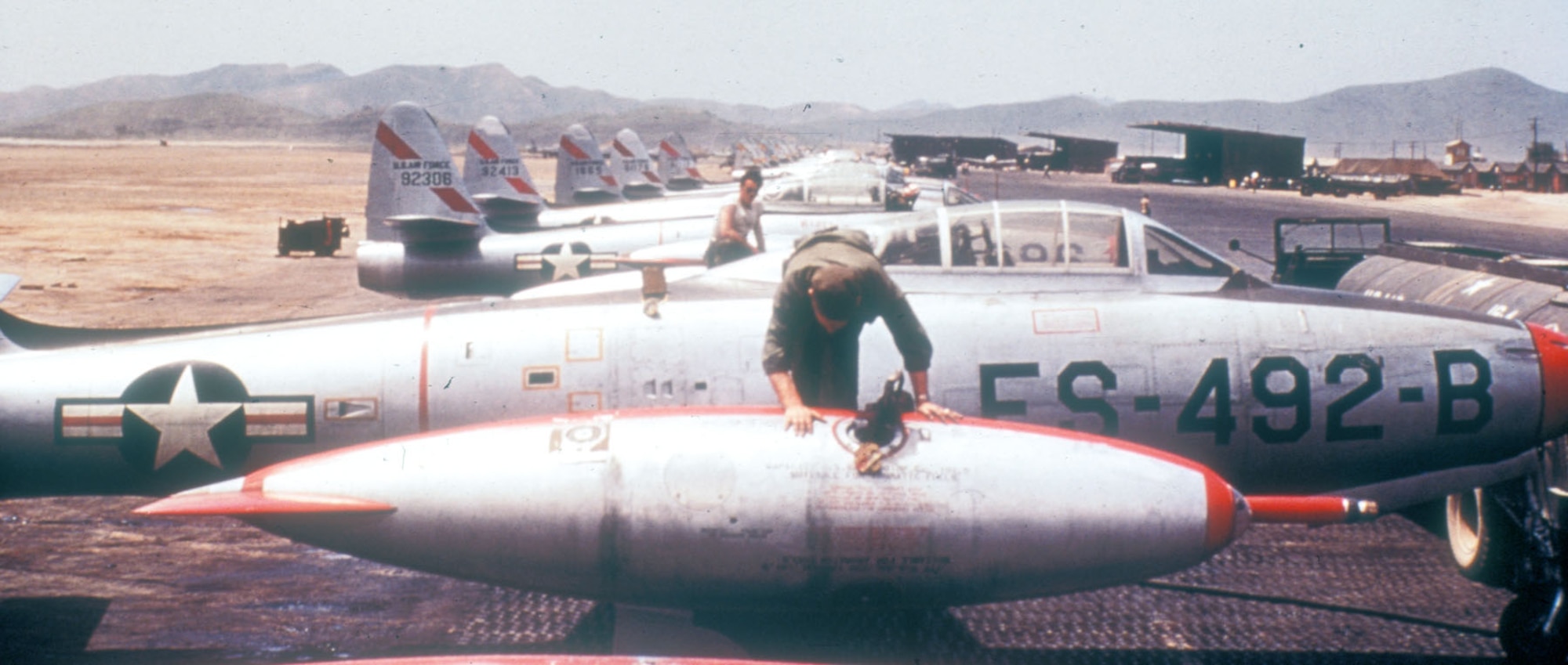 The refueling probe of the type used during OPERATION HIGH TIDE is visible on the front of the wing tip fuel tank of this F-84E. (U.S. Air Force photo)