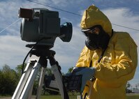 MINOT AIR FORCE BASE, N.D. -- Airman 1st Class Brian Stevens, 5th Civil Engineer Squadron emergency management technician, checks for airborne radiation levels downwind from an attack in a training scenario during Air Combat Command’s Chemical, Biological, Radiation and Nuclear Equipment Challenge here June 3. The CBRNE challenge employs Airmen in the bioenvironmental and emergency management career fields to apply their combined skills in multiple training scenarios in order to ensure combat readiness.  (U.S. Air Force photo by Senior Airman Michael J. Veloz)