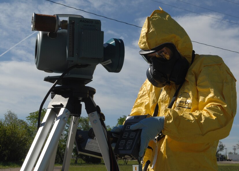 MINOT AIR FORCE BASE, N.D. -- Airman 1st Class Brian Stevens, 5th Civil Engineer Squadron emergency management technician, checks for airborne radiation levels downwind from an attack in a training scenario during Air Combat Command’s Chemical, Biological, Radiation and Nuclear Equipment Challenge here June 3. The CBRNE challenge employs Airmen in the bioenvironmental and emergency management career fields to apply their combined skills in multiple training scenarios in order to ensure combat readiness.  (U.S. Air Force photo by Senior Airman Michael J. Veloz)