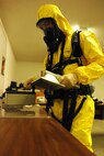 MINOT AIR FORCE BASE, N.D. -- Airman 1st Class Brian Stevens, 5th Civil Engineer Squadron emergency management technician, scans for radiation levels during a training exercise for Air Combat Command’s Chemical, Biological, Radiation and Nuclear Equipment Challenge here June 3. The CBRNE challenge employs Airmen in the bioenvironmental and emergency management career fields to apply their combined skills in multiple training scenarios in order to ensure combat readiness. (U.S. Air Force photo by Airman 1st Class Aaron-Forrest Wainwright)