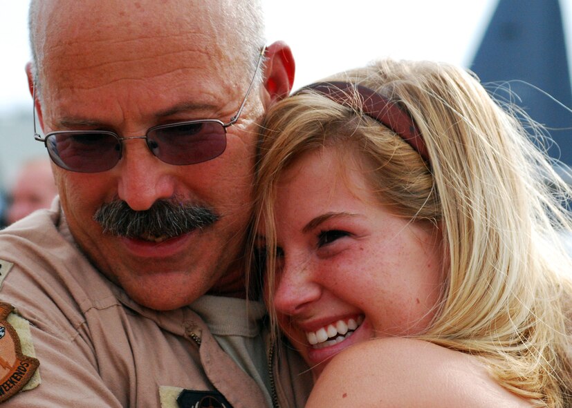 Lieutenant Col. Bud Barth hugs his daughter, Jessie, moments after landing at Eglin Air Force Base, Fla., June 6. More than 70 Airmen from Duke Field returned home from their deployment June 5 and 6. Friends, family, co-workers and community leaders came out to greet them and welcome the Airmen home. (U.S. Air Force photo/TSgt. Cheryl Foster) 