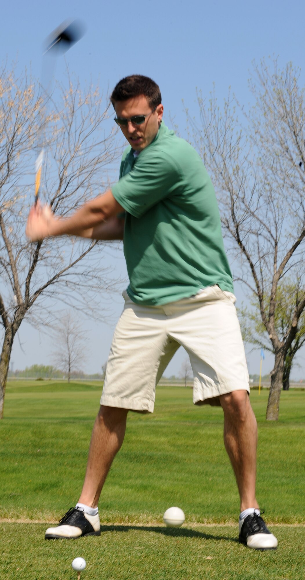 Capt. John Bone, 319th Air Refueling Wing Office of the Staff Judge Advocate, tees-off during the 319th Security Forces Golf Tournament, May 14 that was held for the National Police Week at the Plainsview golf course here. The tournament consisted of four-person teams, each participant played 18-holes and the team with the lowest combined score wins. (U.S. Air Force photo by Airman 1st Class Amber Price)