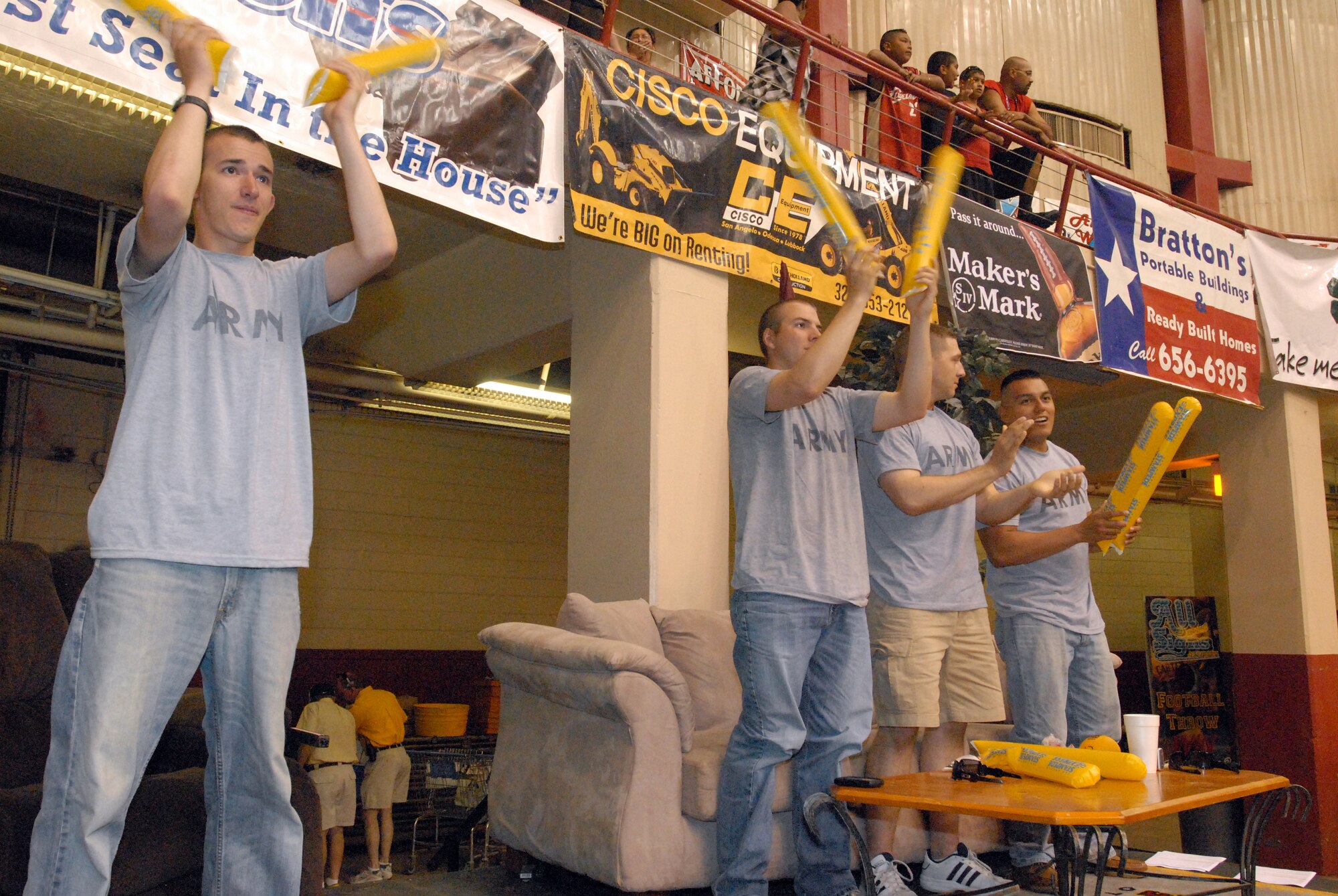 Pfc. Travis Foushee, Pfc. Marvin Morris, Spc. Benjamin Gregorio, and Pvt. Adrain Delossantos enjoy the best seats in town during the San Angelo Stampede Express Indoor Football League game June 5.  The Stampede honored military members with a military appreciation night. (U.S. Air Force photo/ Master Sgt. Randy Mallard)