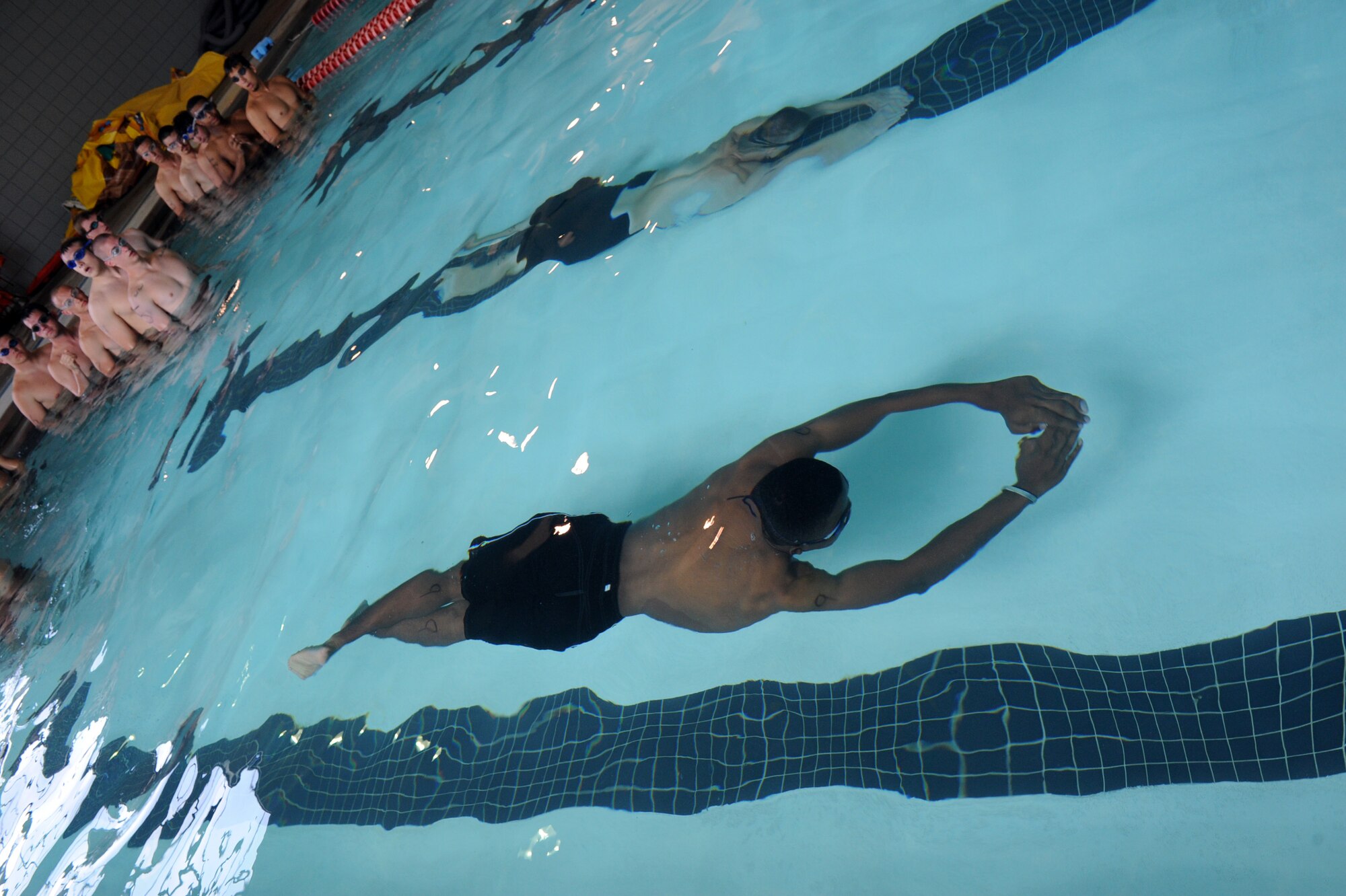 Air Force recruits practice techniques to improve their speed and power while swimming under water during an Air Force Recruiting Service program June 3 at Jacksonville Community Center. The program is designed to help prepare Air Force recruits to meet the physical challenges expected of them during their initial processing into a Battlefield Airmen career field.  Community center officials made their indoor facilities available when inclement weather forced organizers out of the base’s outdoor pool.  (U.S. Air Force photo by Senior Airmen Ethan Morgan)