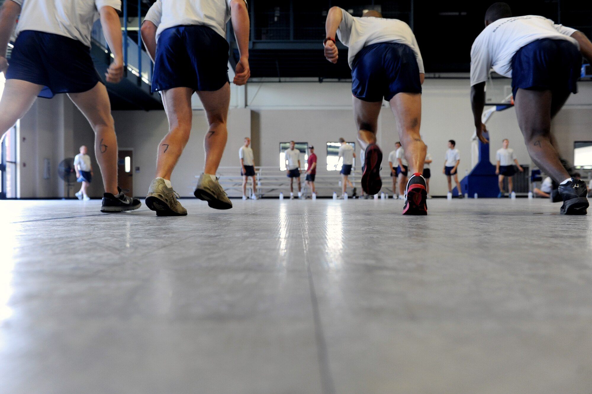 Air Force Recruits are shown techniques June 3 to help improve their fitness at the base fitness center during an Air Force Recruiting Service program here. The program is designed to help prepare Air Force recruits to meet the physical challenges expected of them during their initial processing into a Battlefield Airmen career field.  (U.S. Air Force photo by Senior Airmen Ethan Morgan)