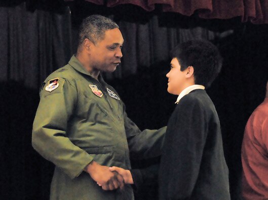 Maj. Gen. Garry C. Dean, 1st Air Force commander, congratulates Wyatt Kirby Sanders during Tyndall Elementary School’s 5th Grade Recognition Ceremony June 4, 2010.