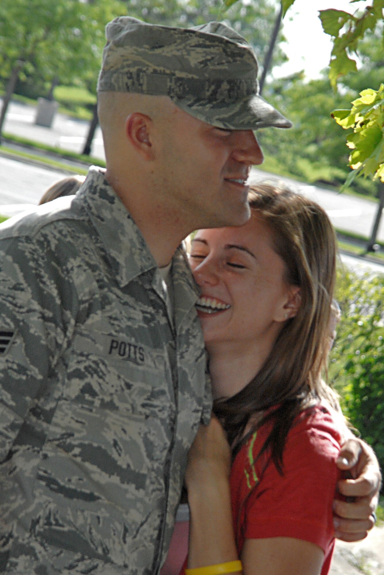 GRISSOM AIR RESERVE BASE, Ind. -- Senior Airman Timothy Potts, a fire team member with the 434th Security Forces Squadron, holds his wife Kasey on Monday following his return from a six-month deployment to Kirkuk Iraq. Airman Potts, a resident of Wakarusa, and other members of the 434th SFS were greeted by friends, family and coworkers upon their return. (U.S. Air Force photo/Tech. Sgt. Douglas Hays)