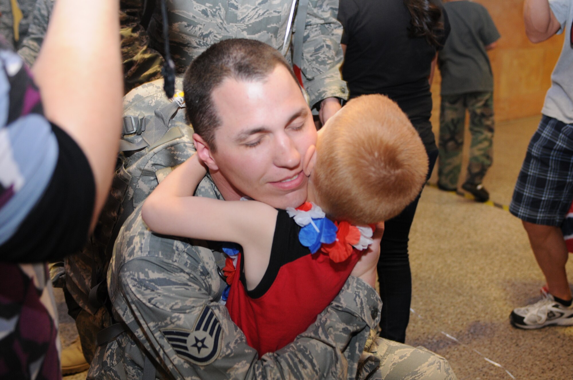 Staff Sgt. Jonathan Morphew is welcomed home after a five-month deployment to Iraq, June 7. Family and friends celebrated the return of 29 security forces Airmen assigned to the 162nd Fighter Wing at Tucson International Airport. (Air Force photo by Maj. Gabe Johnson)