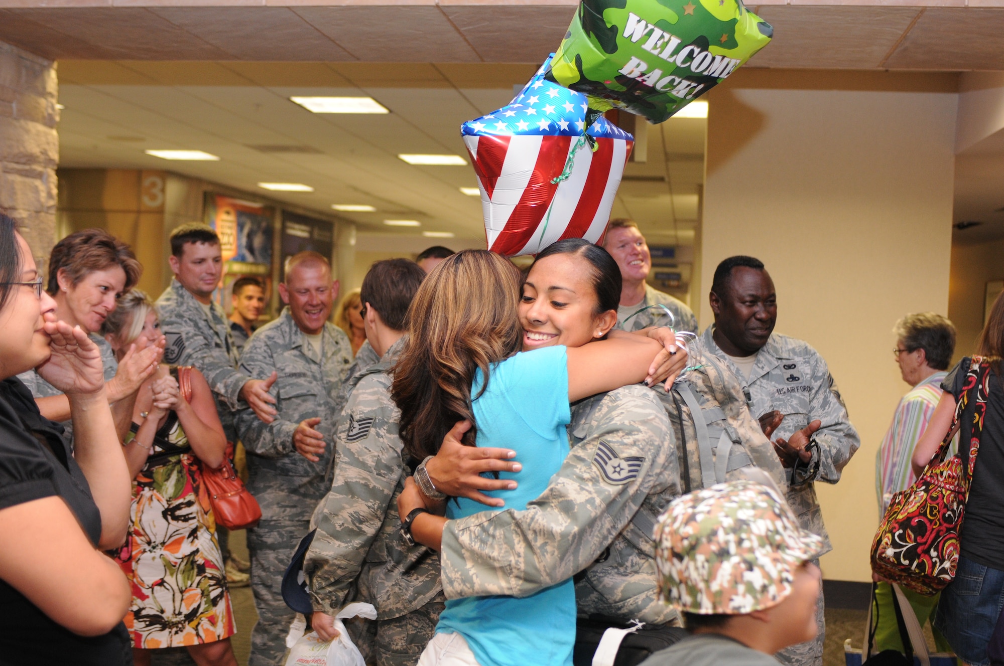 Staff Sgt. Patricia Pacheco is welcomed home after a five-month deployment to Iraq, June 7. Family and friends celebrated the return of 29 security forces Airmen assigned to the 162nd Fighter Wing at Tucson International Airport. (Air Force photo by Maj. Gabe Johnson)