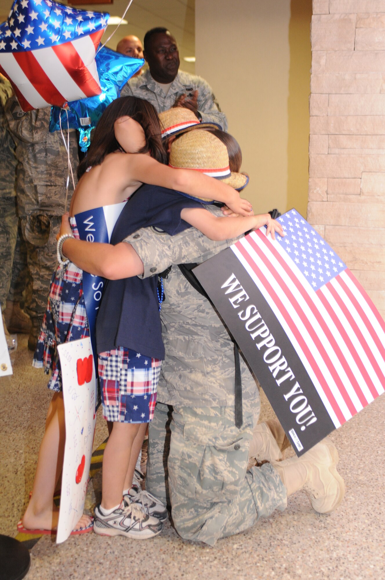 Staff Sgt. Boradel Medrano is welcomed home after a five-month deployment to Iraq, June 6. Family and friends celebrated the return of 29 security forces Airmen assigned to the 162nd Fighter Wing at Tucson International Airport. (Air Force photo by Maj. Gabe Johnson)