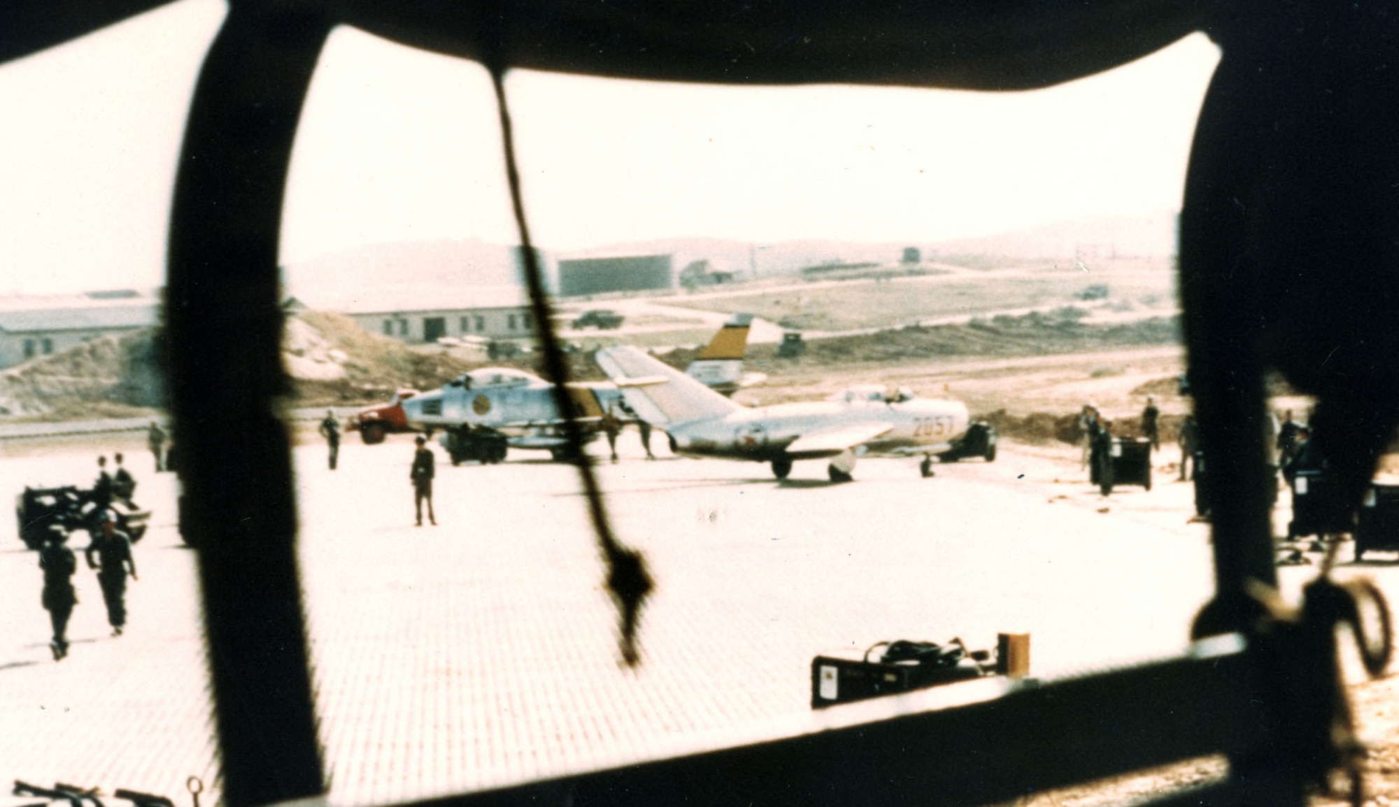 Lt. No Kum-Sok’s MiG-15bis next to an F-86 at Kimpo Air Base about five minutes after he had landed. This photo was taken without permission from the rear of a passing truck. (U.S. Air Force photo)