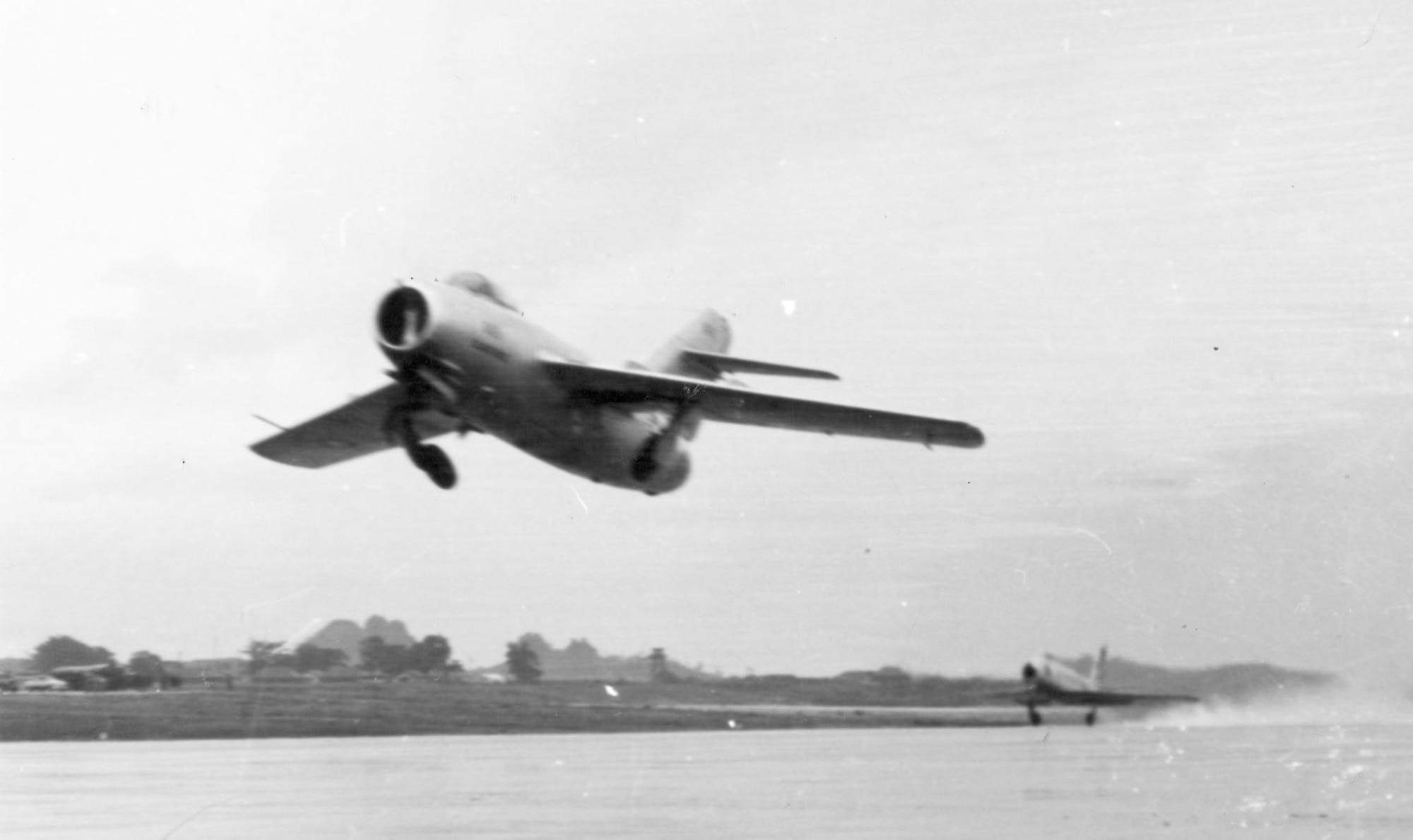 Taking off on its first USAF test flight in Okinawa, followed by an F-86. (U.S. Air Force photo)