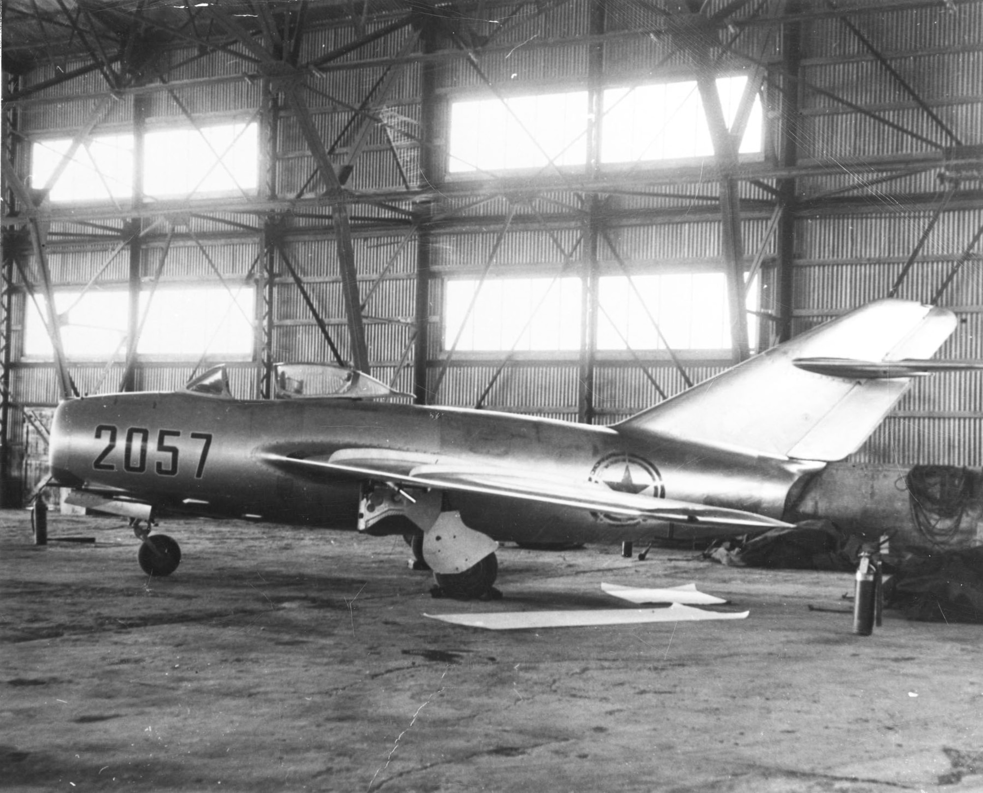 The MiG-15b is secured in a hangar at Kimpo Air Base. (U.S. Air Force photo)