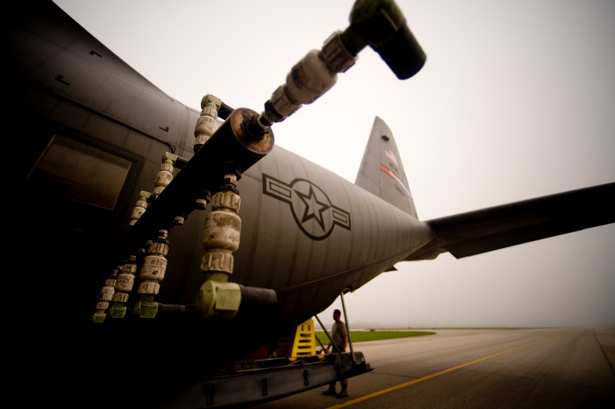 A U.S. Air Force C-130 aerial spray aircraft from the 910th Airlift Wing at Youngstown-Warren Air Reserve Station, Ohio, is prepared at Stennis International Airport in Kiln, Miss. to go on a chemical dispersing mission May 4, 2010. Members of the 910th Airlift Wing (AW) are in Mississippi to assist with the Deepwater Horizon oil spill. The 910th AW specializes in aerial spray and is the Department of Defense?s only large-area fixed-wing aerial spray unit. (U.S. Air Force photo by Tech. Sgt. Adrian Cadiz/Released)