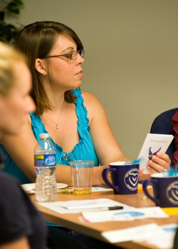 LANGLEY AIR FORCE BASE, Va. -- Mindy Umbaugh,  wife of Senior Airman  Joseph Umbaugh, listens to the Airman’s Creed during a HeartLink presentation at the Airman and Family Readiness Center June 4. The AFRC started in the 1980s from a concept in which military families would help other families assimilate into the military lifestyle. (U.S. Air Force photo/Senior Airman Zachary Wolf)