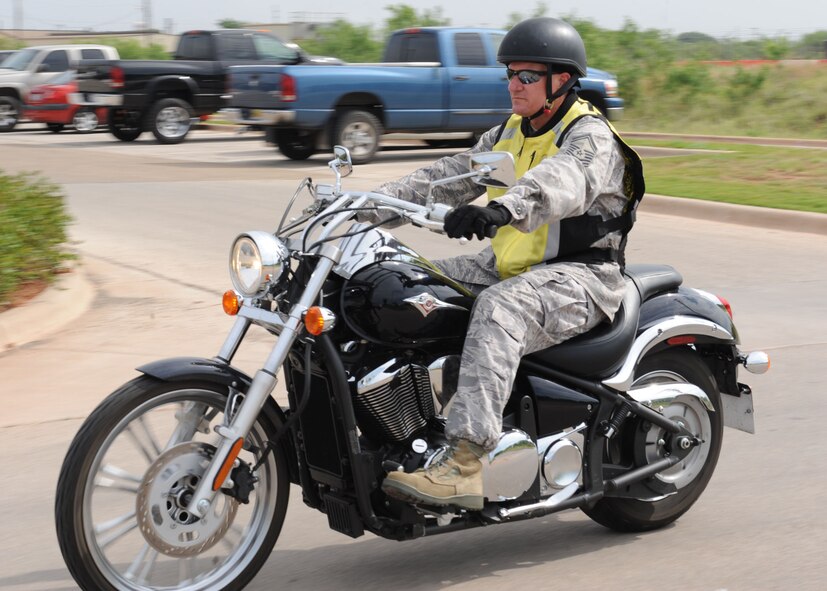 DYESS AIR FORCE BASE, Texas-- Senior Master Sgt. Phillip Boyes, 7th Aircraft Maintenance Squadron, wears his safety gear while riding on his motorcycle June 7 here. 7th Bomb Wing Safety offers motorcycle safety foundation courses that consist of a basic rider course and an experienced rider course. For more information on motorcycle safety courses, call safety at (325) 696-5598. (U.S. Air Force photo/Airman 1st Class Brittney Smolinski) 
