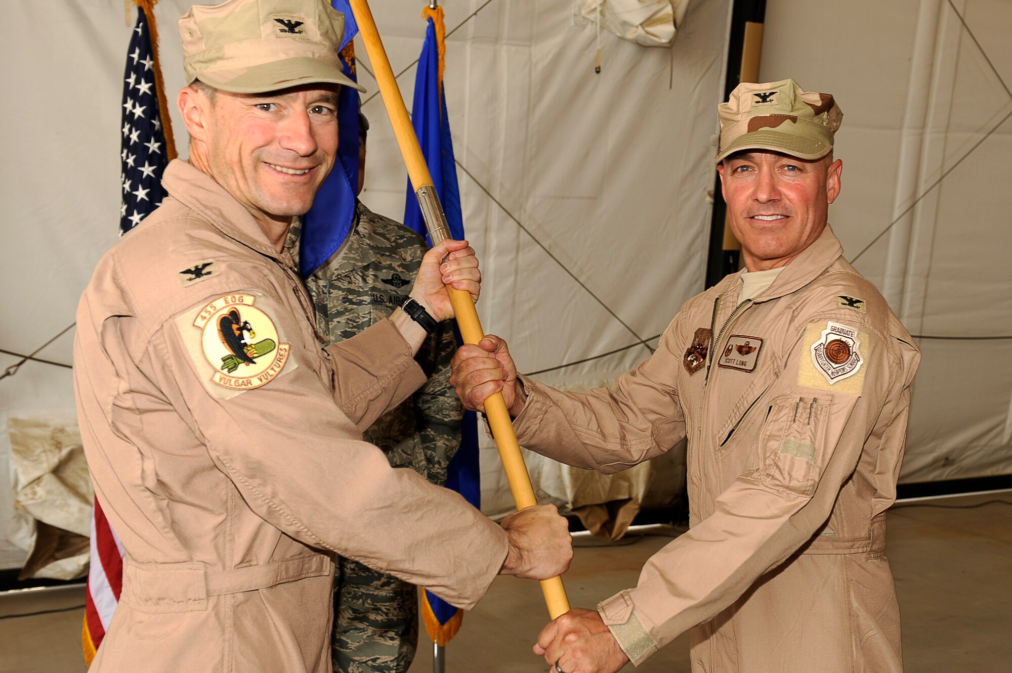 U.S. Air Force Col. Jack Briggs, commander, 455th Air Expeditionary Wing turns over command of the 455th Expeditionary Operations Group to Col. Scott Long at Bagram Airfield, Afghanistan June 8, 2010. Colonel Long is from Homestead, Fla. (U.S. Air Force photo by/ Master Sgt. Jeromy K. Cross/released)








