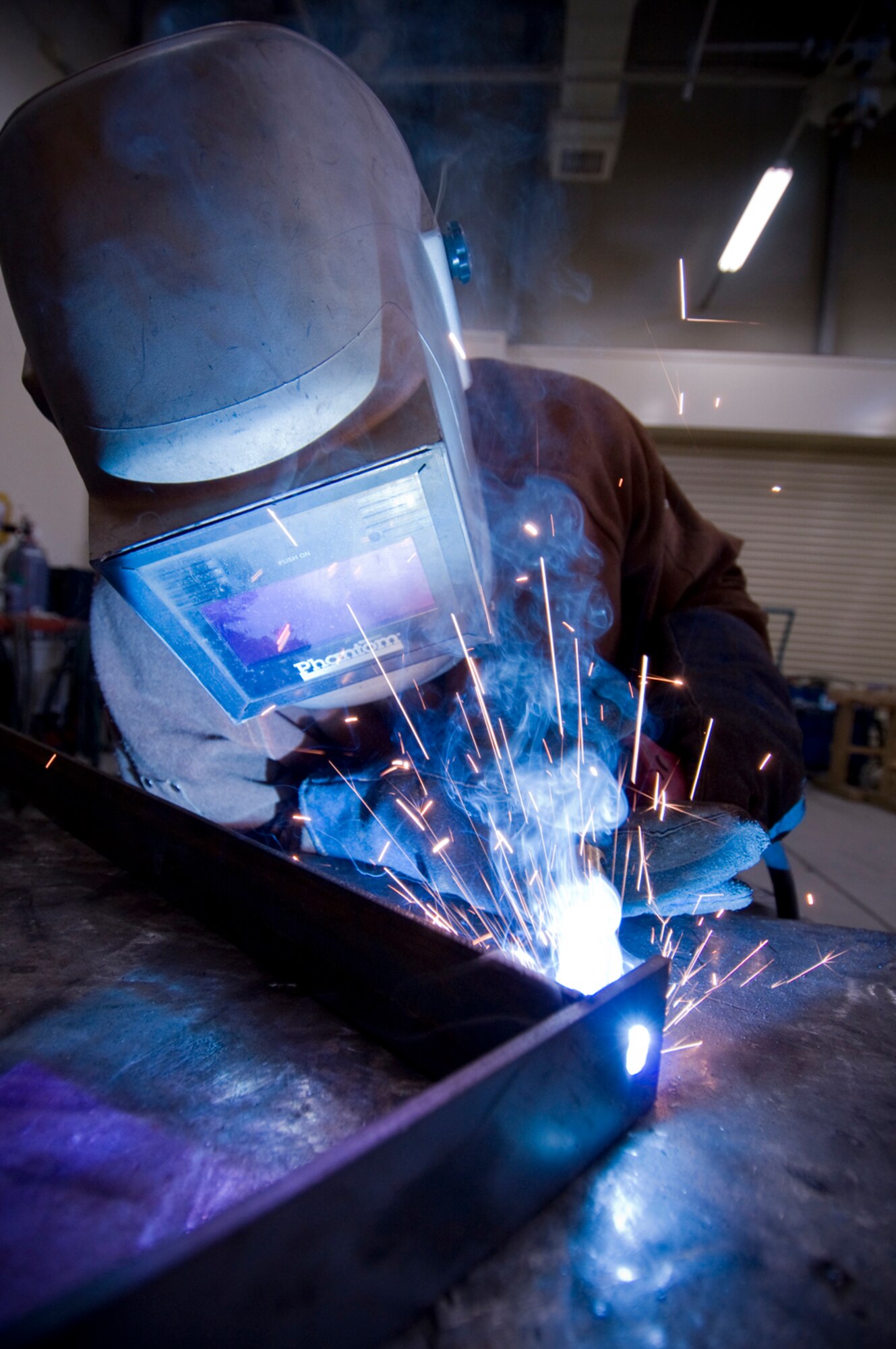 MISAWA AIR BASE, Japan -- Airman 1st Class John Ellis, a 35th Civil Engineer Structures Flight structural apprentice, welds one of 60 brackets used for an ongoing CES project. The York, Pa., native, has spent more than 55 hours on the project, which began mid-May and is scheduled to be completed by the beginning of July. (U.S. Air Force photo/Senior Airman Jessica Lockoski)