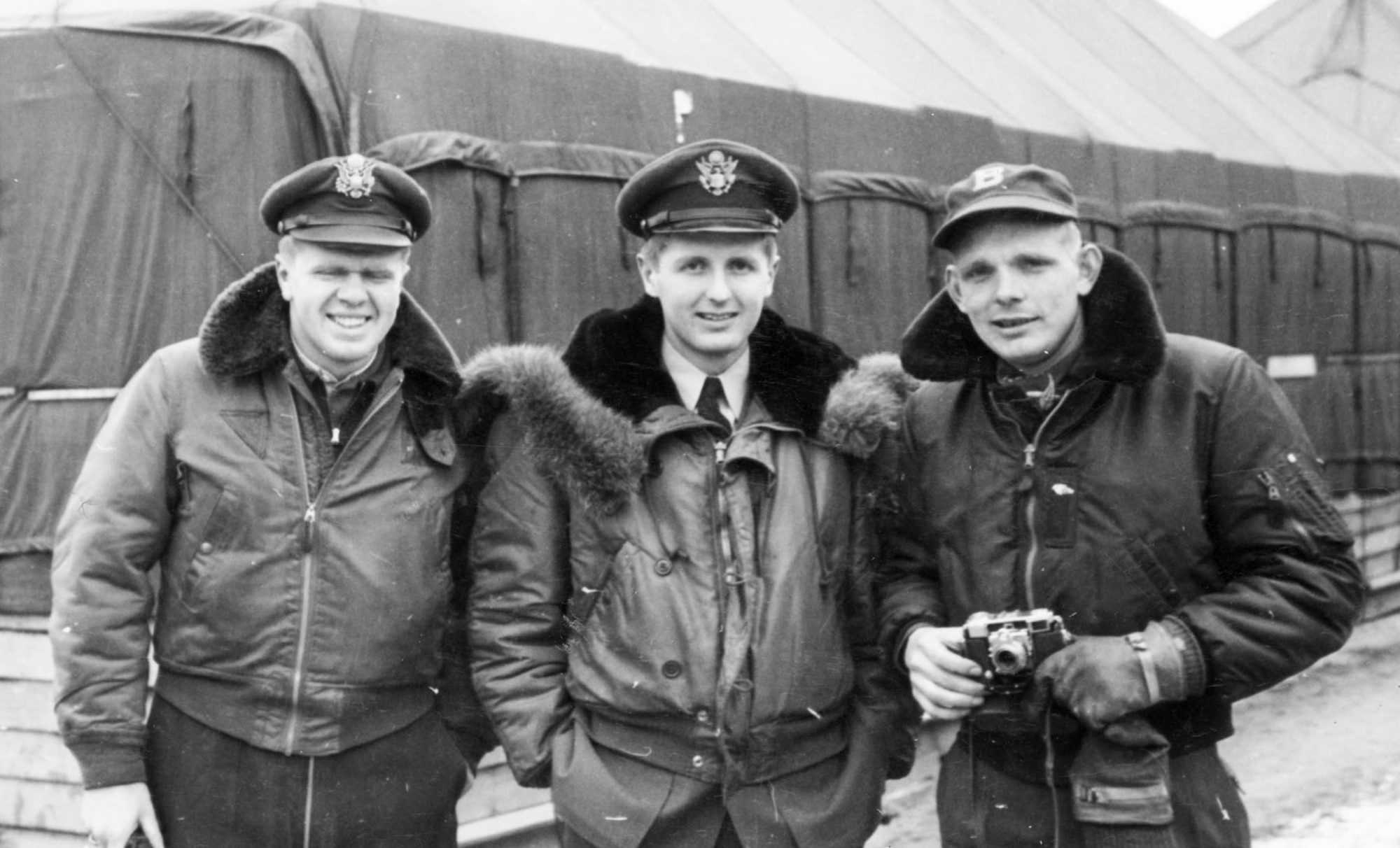 Capt. Iven C. Kincheloe Jr. (with camera) and two friends after arriving in Korea in 1951. (U.S. Air Force photo)