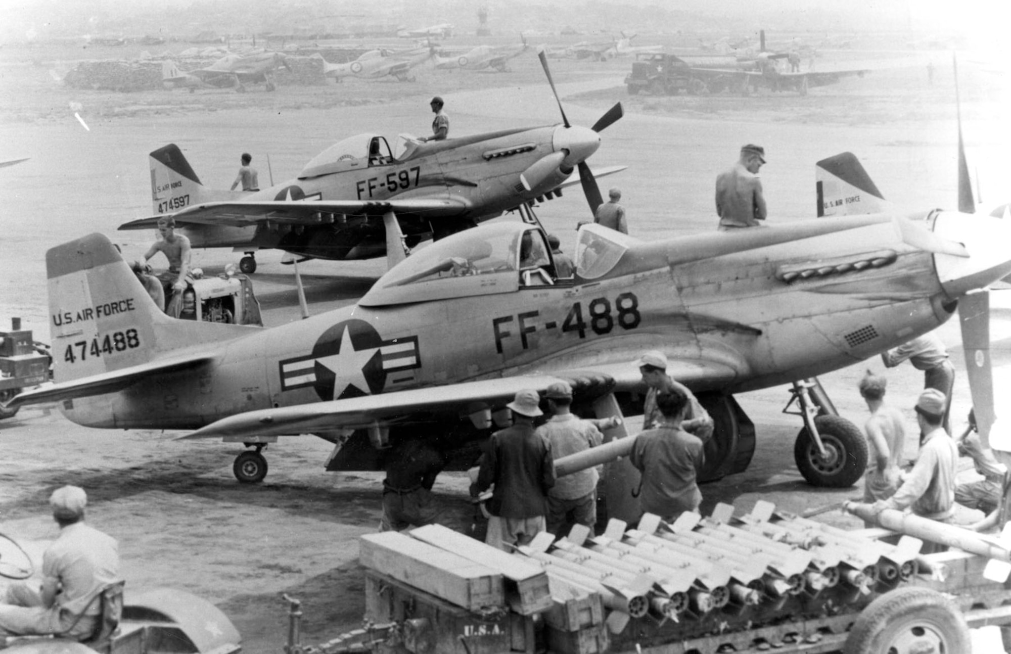 Loading 5-inch HVARs (High Velocity Aircraft Rocket) for a mission. (U.S. Air Force photo)