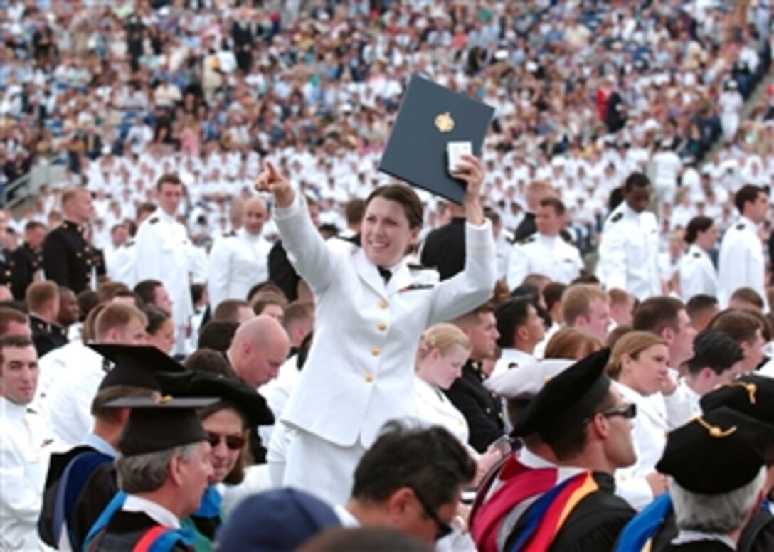 A U.S. Naval Academy midshipman celebrates after receiving her diploma during the academy's 2010 graduation and commissioning ceremony at Navy-Marine Corps Memorial Stadium in Annapolis, Md., on May 28, 2010.  The Class of 2010 included 755 graduates commissioned as U.S. Navy ensigns and 257 commissioned as U.S. Marine Corps 2nd lieutenants.  