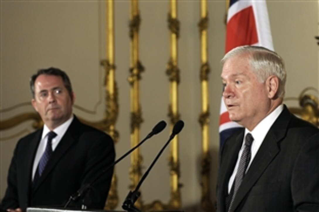 U.S. Defense Secretary Robert M. Gates, right,  speaks at a press conference at the Lancaster House in London, June 8, 2010, while British Defense Secretary Liam Fox looks on.