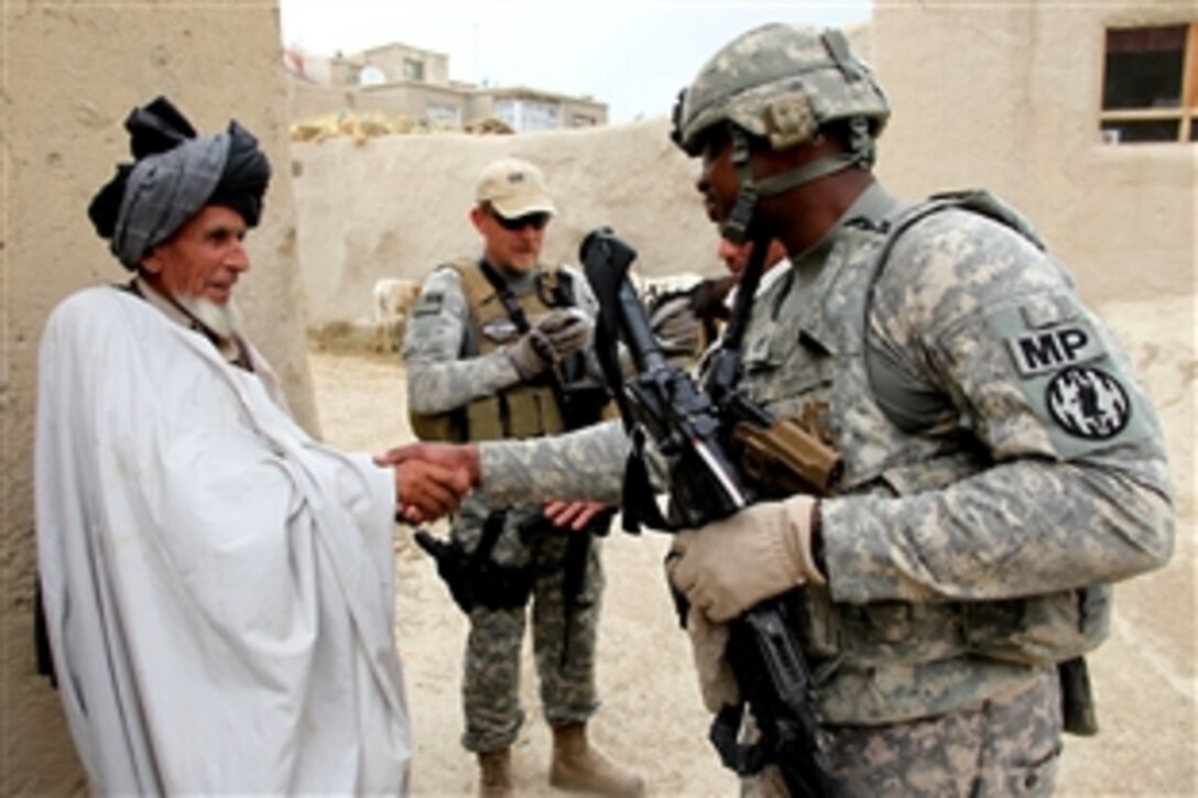U.S. Army Staff Sgt. Michael Baldwin shakes hands with an elder in the village of Mirsaleh in the Logar province of Afghanistan, June 6, 2010. Baldwin is assigned to the 401st Military Police Company, 720th MP Battalion, 89th MP Brigade.