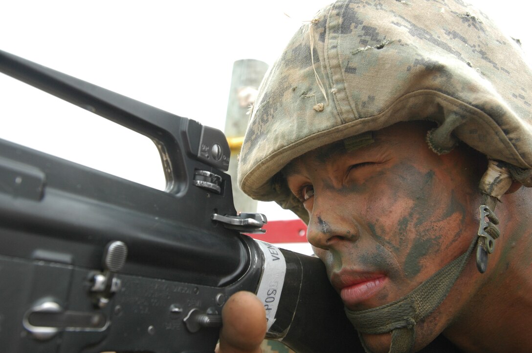 Recruit Travis Venerable, 23, of Midland, Texas, provides cover for his fellow recruits at the Crucible’s Confidence Course, Edson Range, Marine Corps Base Camp Pendleton, Calif., June 8. Prior to enlisting in the Marine Corps, Venerable had worked as a bartender, been on a reality TV show, earned $90,000 a year as an oil driller, and had what he called a 'dream job' as a field engineer.