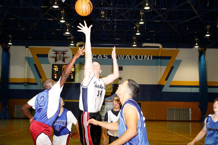 Martin White, power forward for the Goon Squad, puts the ball up for a 2-pointer during an intramural basketball game at IronWorks Gym here June 8. The Goon Squad added another win to their name when they defeated the Diablos 52-46.