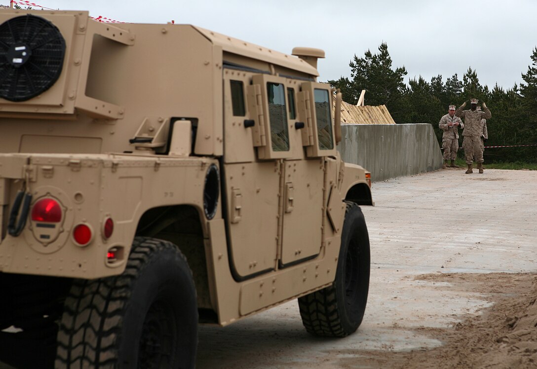 An up-armored HMMWV drives through a recently constructed ramp designed to allow greater access to the beach during the maritime preposition force (MPF) offload portion of exercise BALTIC OPERATIONS 2010. The MPF offload portion is one of largest portions of exercise BALTOPS, a multinational maritime exercise designed to increase interoperability between the 12 participating nations and increase maritime safety and security.