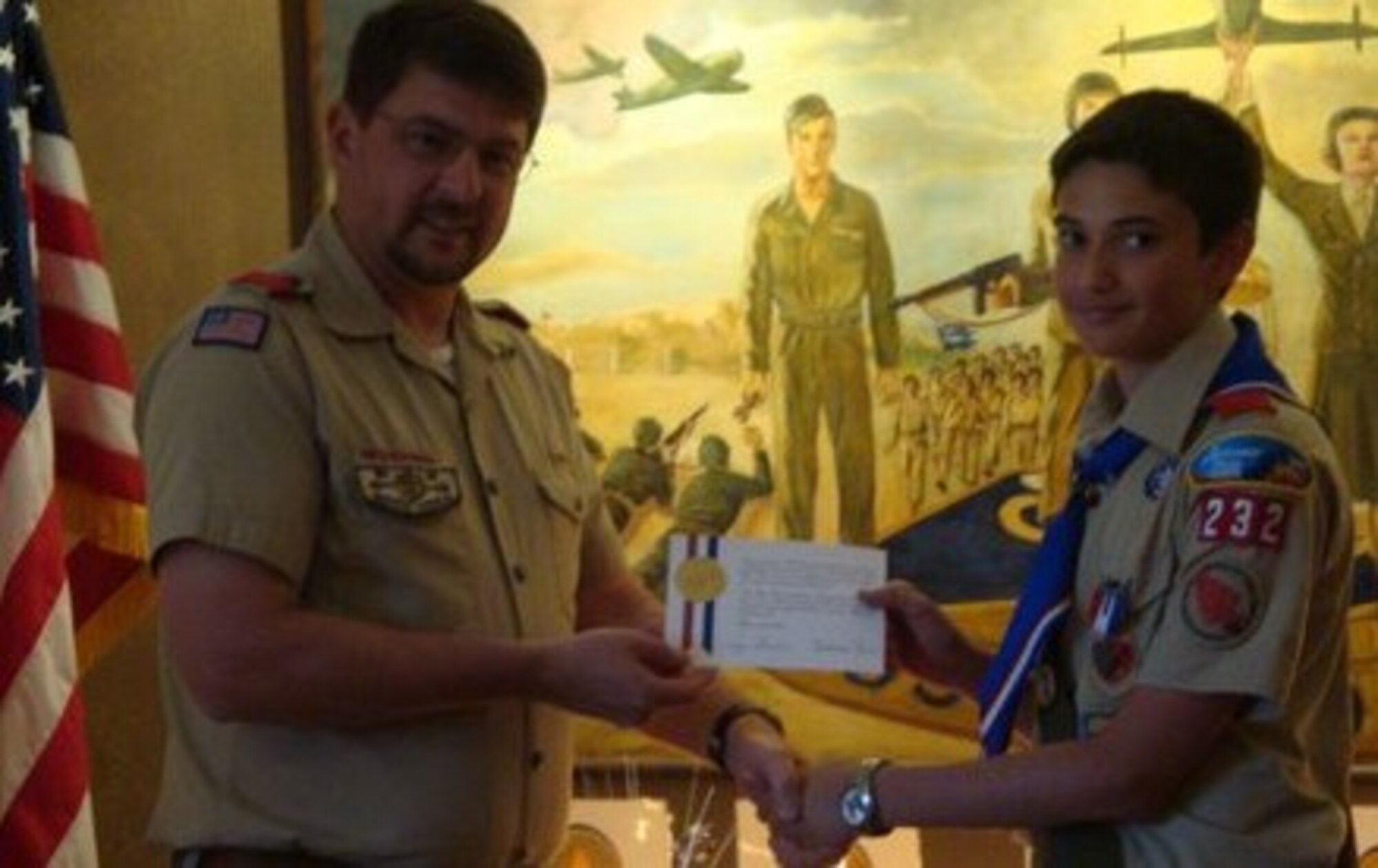 Michael Trebins (left), committee chairman for Boy Scout Troop 232, presents Kynan Franke, 15-year-old, with a letter of congratulations from former president George Bush for achieving the rank of Eagle Scout at the Heritage Center on Sheppard Air Force Base, Texas, June 5, 2010.  Eagle Scout is the highest rank a Boy Scout can achieve.  (U.S. Air Force courtesy photo)