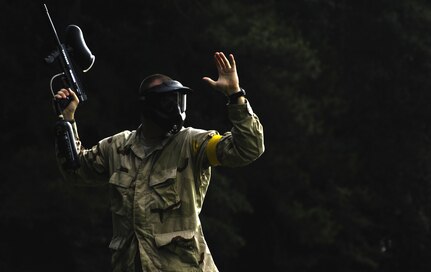 An Airman surrenders after taking a direct hit during the Commander's Fitness Challenge paintball tournament at the base picnic grounds June 4, 2010, at Joint Base Charleston, S.C. The tournament was organized by the Outdoor Recreation Center. (U.S. Air Force photo/Airman 1st Class Lauren Main)