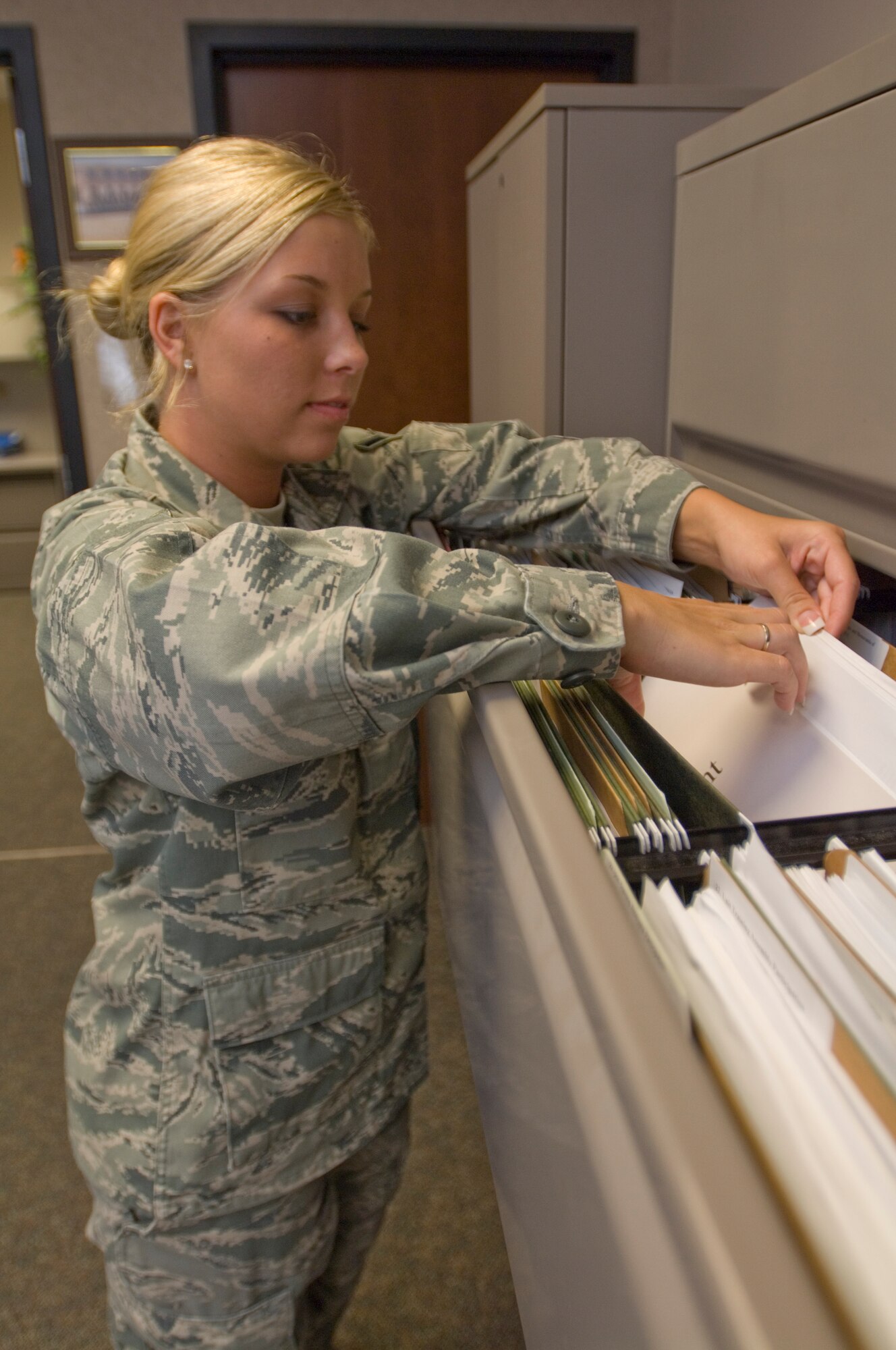 Airman Brittnie Mathi, 931st Maintenance Operations Flight Knowledge Operations manager, files military orders for the more than 150 members of the 931st Air Refueling Group.  In addition to filing orders, the Kansas City, Mo., native is also responsible handling, directing, governing and controlling natural knowledge processes within the 931st ARG. (U.S. Air Force photo/Senior Airman Abigail Klein)