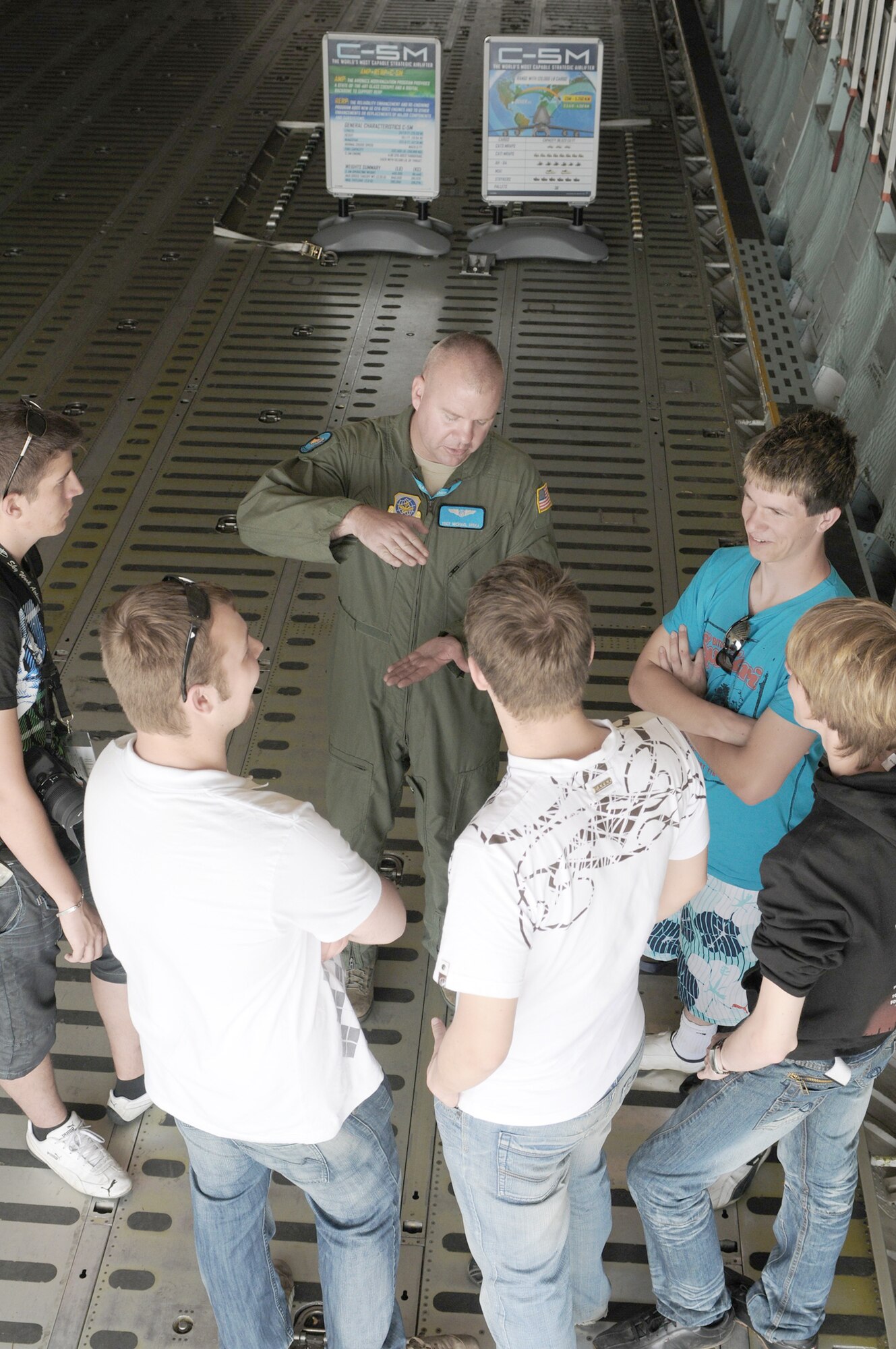 Tech. Sgt. Michael Miska answers questions from visitors during the 2010 Berlin International Aerospace Exhibition and Conferences Air Show June 8 at Berlin-Schoenefeld Airport in Berlin. Sergeant Miska is a 9th Airlift Squadron loadmaster from Dover Air Force Base, Del. (U.S. Air Force photo/Staff Sgt. Julius Delos Reyes) 