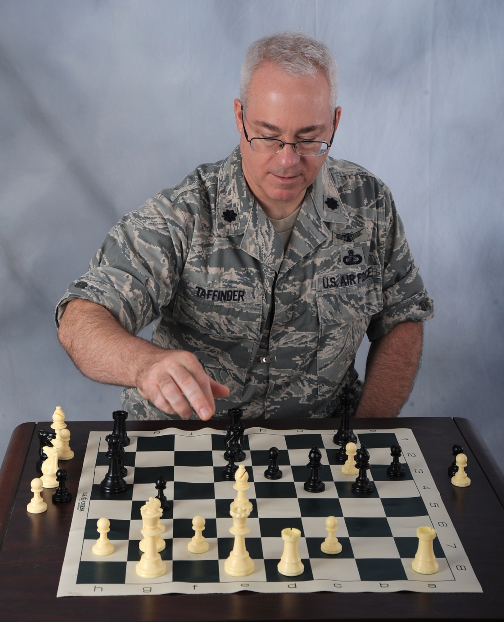 OFFUTT AIR FORCE BASE, Neb. -- Lt. Col. Douglas Taffinder poses for a studio photo after winning the 2010 Air Force Chess Tournament May 15 at Wright-Patterson AFB, Ohio. The lieutenant colonel, assigned to U.S. Strategic Command Headquarters, will now represent the Air Force during the 2010 Inter-service Championships set for Aug. 2 - 6 at Naval Station Great Lakes, Ill. U.S. Air Force photo by D.P. Heard