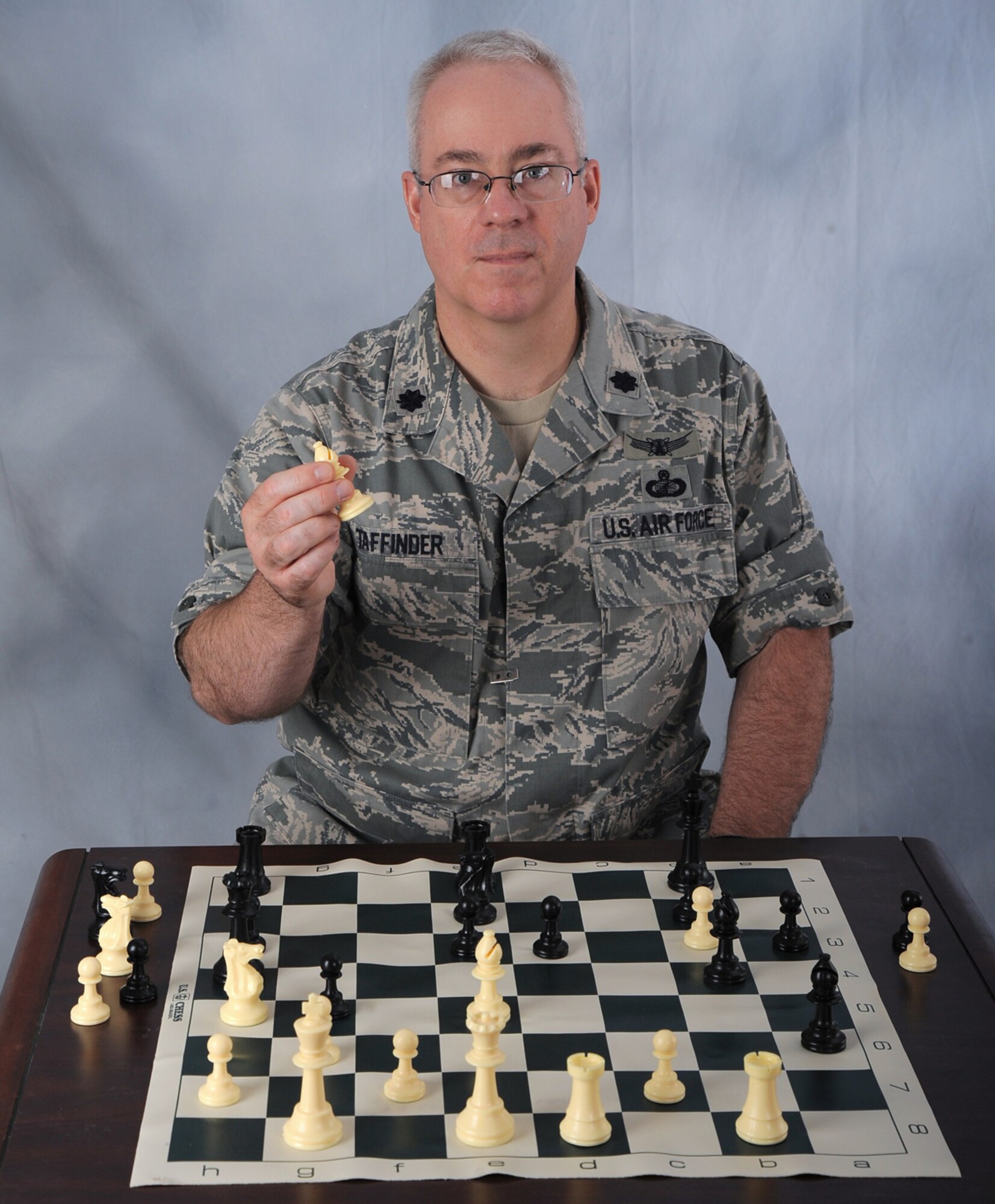 OFFUTT AIR FORCE BASE, Neb. -- Lt. Col. Douglas Taffinder poses for a studio photo after winning the 2010 Air Force Chess Tournament May 15 at Wright-Patterson AFB, Ohio. The lieutenant colonel, assigned to U.S. Strategic Command Headquarters, will now represent the Air Force during the 2010 Inter-service Championships set for Aug. 2 - 6 at Naval Station Great Lakes, Ill. U.S. Air Force photo by D.P. Heard