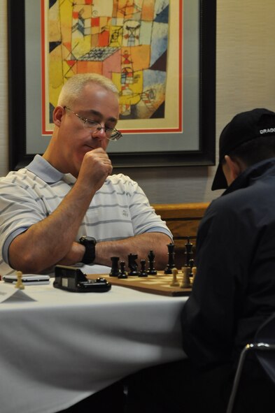 WRIGHT-PATTERSON AIR FORCE BASE, Ohio -- Lt. Col. Douglas Taffinder contemplates his next move during the 2010 Air Force Chess Tournament here May 15. The lieutenant colonel, assigned to U.S. Strategic Command Headquarters at Offutt AFB, Neb., was crowned the Air Force chess champion and will represent the service during the 2010 Inter-service Championships set for Aug. 2 - 6 at Naval Station Great Lakes, Ill. U.S. Air Force photo by Ryan P. Burger