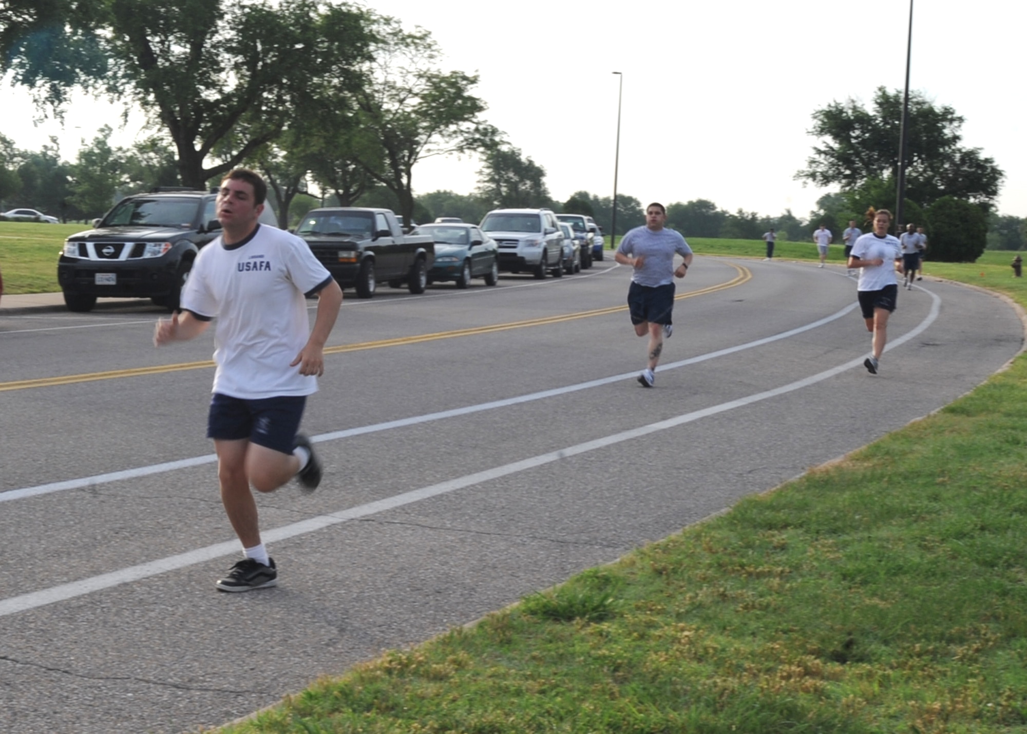 U.S. Air Force Academy cadets run a 5K with Team McConnell’s 22nd Civil Engineer Squadron members June 4, 2010, McConnell Air Force Base, Kan. Nine USAFA cadets are visiting McConnell this month as part of the USAFA Cadet Summer Research Program to experience day-to-day operational Air Force activities by visiting a variety of squadrons on base. The USAFA educates and trains individuals to become commissioned officers in the USAF. (U.S. Air Force photo/ Senior Airman Maria Ruiz)