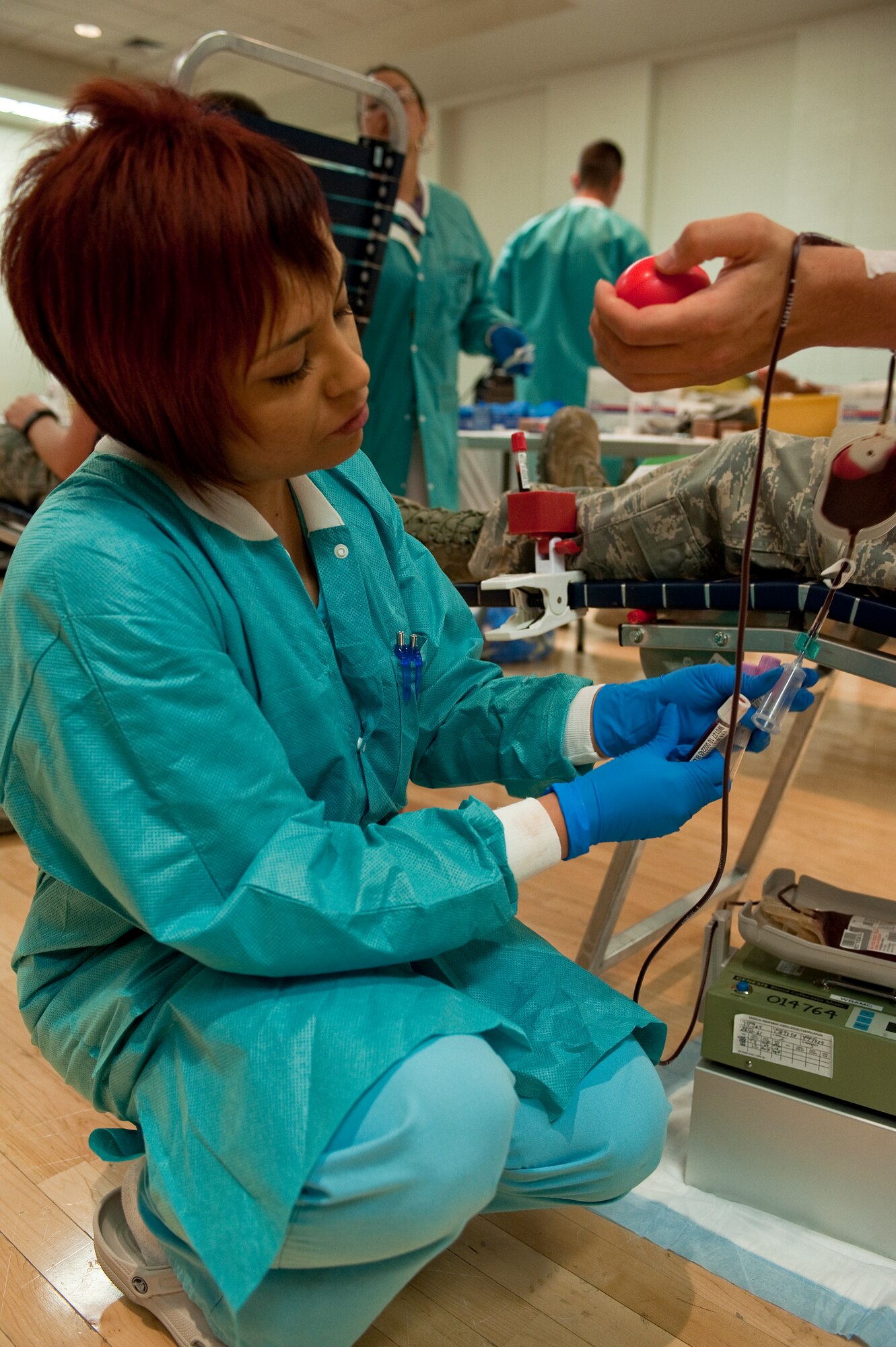 HOLLOMAN AIR FORCE BASE, N.M. -- A phlebotomist with the Armed Forces Blood Program prepares to take blood for a testing sample from Airman 1st Class Jacob Shoff, 49th Civil Engineer Squadron, during a blood drive June 7, 2010. Airman Shoff has donated blood eight times, but the latest donation is his first at Holloman. Blood donation is a common practice and promoted to the civilian and military populations through programs sponsored by the American Red Cross and Armed Services Blood Program. (U.S. Air Force photo by Senior Airman DeAndre Curtiss / Released)