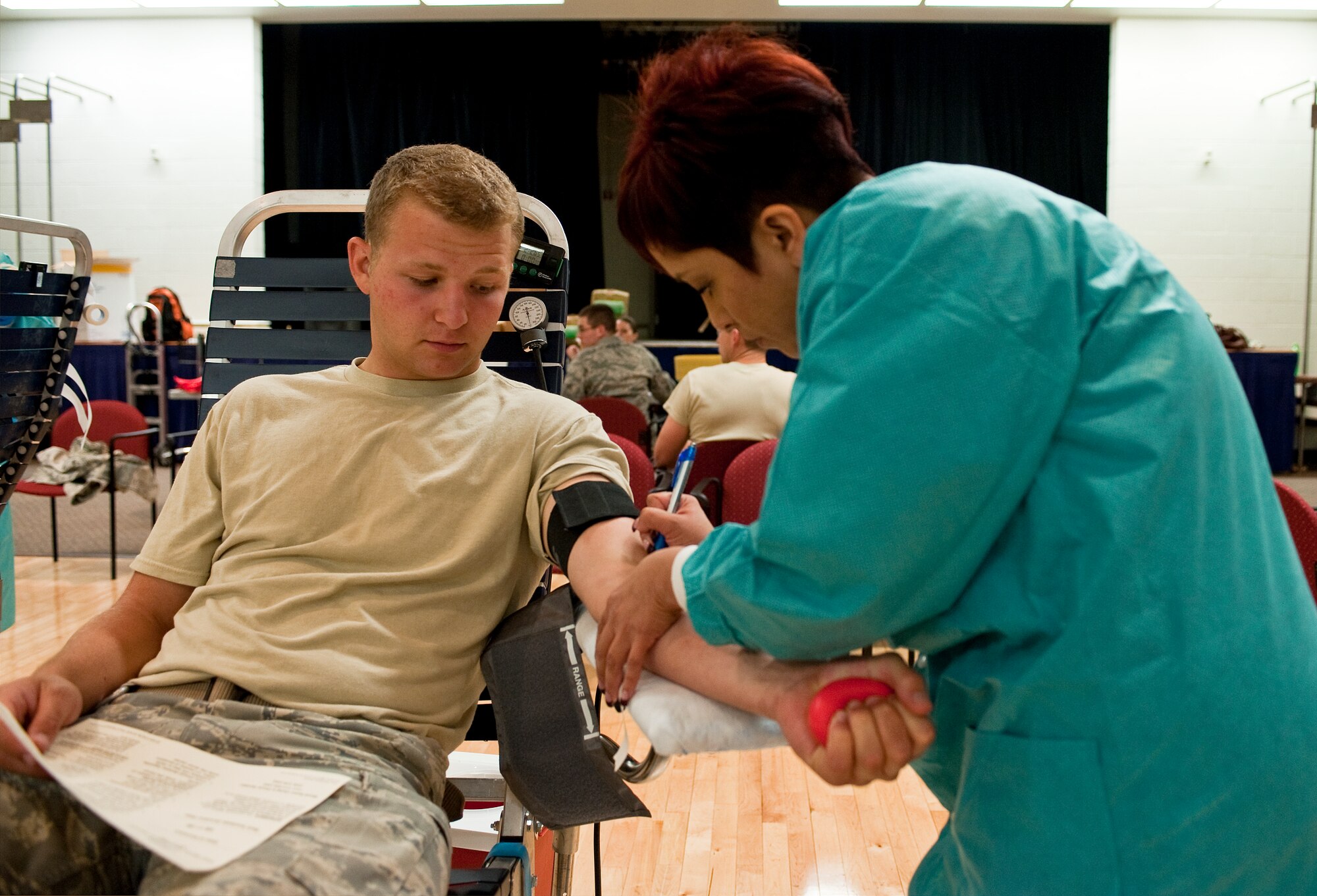 HOLLOMAN AIR FORCE BASE, N.M. -- Airman 1st Class Jacob Shoff, 49th Civil Engineers Squadron, receives a mark to indicate where to insert the needle for blood donation at the Armed Services Blood Drive June 7, 2010. The Armed Services Blood Program provides quality blood products for service members and their families in both peace and war. As a joint operation among the military services the ASBP has many components working together to collect, process, store, distribute and transfuse blood worldwide. (U.S. Air Force photo by Senior Airman DeAndre Curtiss / Released)