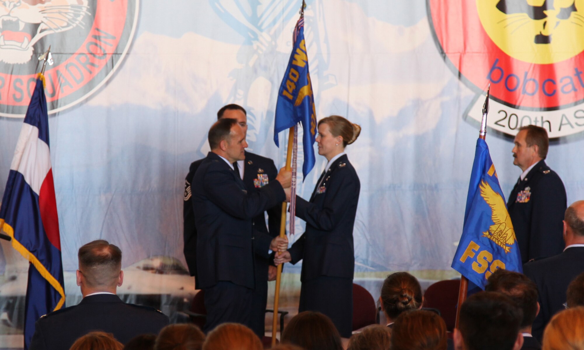 Colonel Barbara C. Morrow is presented with the guidon as she assumes command of the 140th Mission Support Group, 140th Wing, Colroado Air National Guard at Buckley Air Force Base June 5.