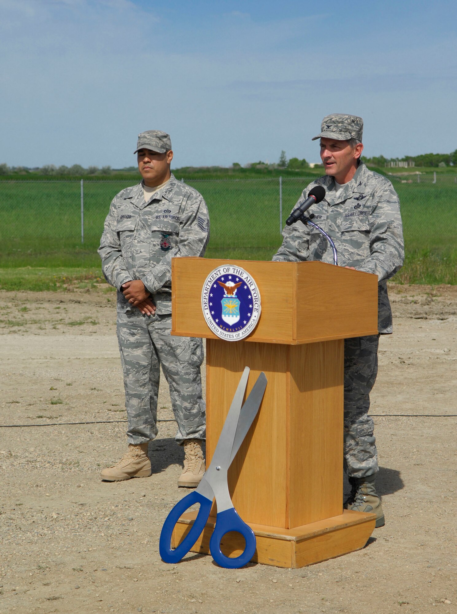 MINOT AIR FORCE BASE, N.D. -- Col. James Gallagher, 5th Mission Support Group commander, explains the importance of the new five-story structural fire trainer during the ribbon cutting ceremony here June 7. The new fire training facility can be used in any type of weather to increase the readiness of base and local community firefighters. (U.S. Air Force photo by Senior Airman Ashley N. Avecilla)