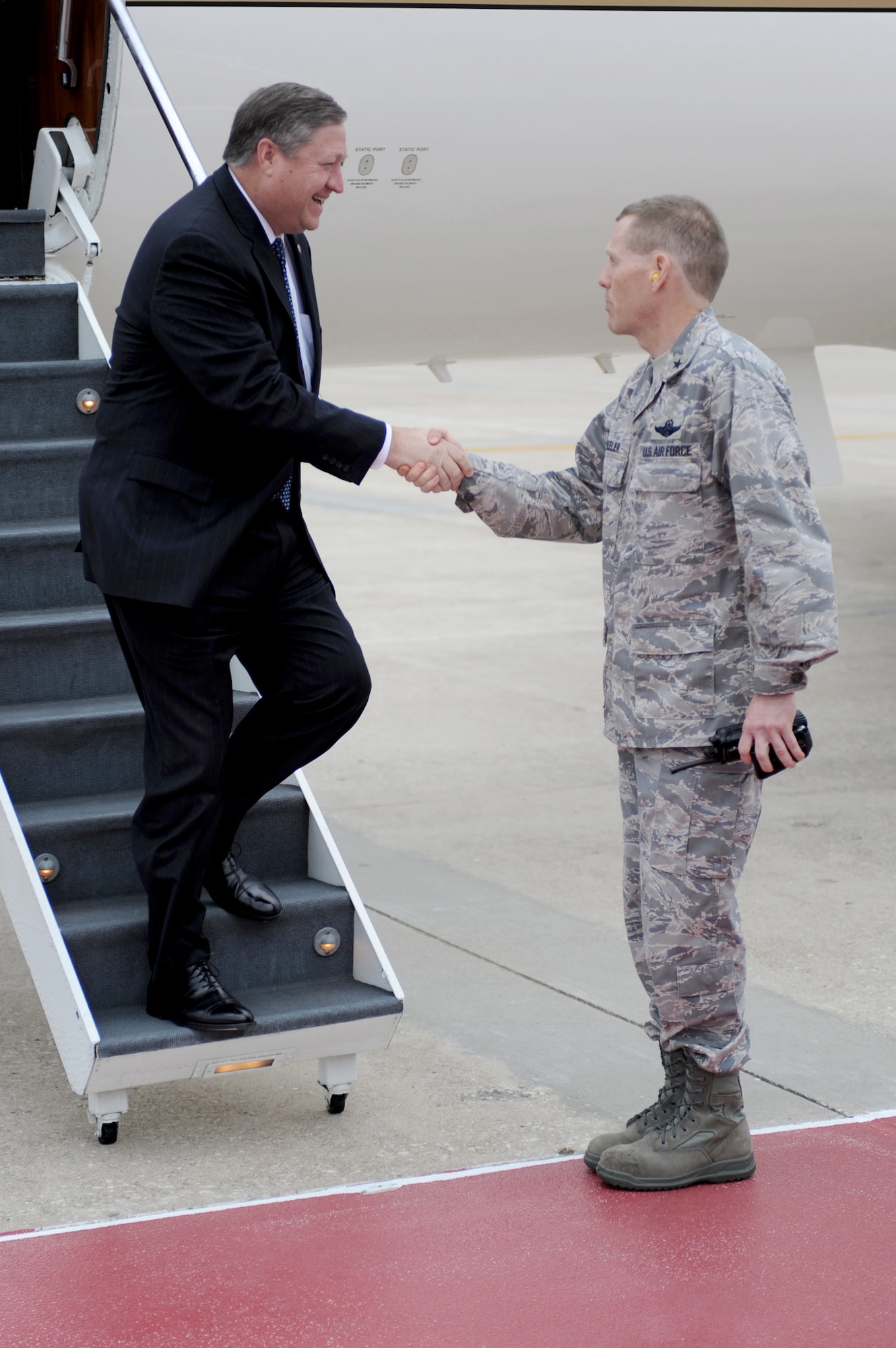 Secretary of the Air Force Michael Donley is greeted by Brig. Gen. Robert Wheeler June 8, 2010, at Whiteman Air Force Base, Mo. Secretary Donley visited Whiteman AFB to become more familiar with the wing's mission and speak with base Airmen. General Wheeler is the 509th Bomb Wing commander. (U.S. Air Force photo/Airman 1st Class Carlin Leslie)