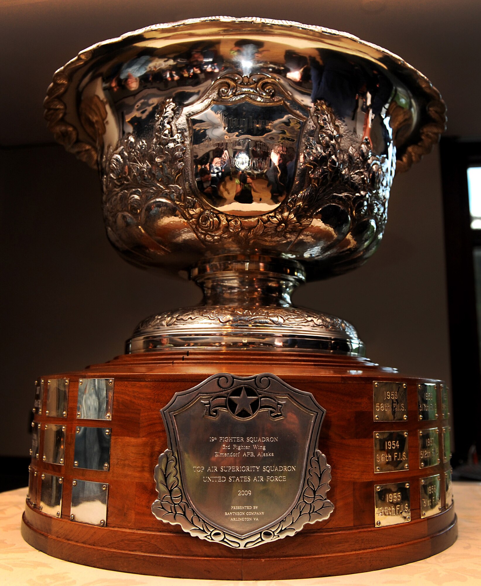 The 2009 Raytheon Trophy was awarded to the 19th Fighter Squadron. The mission of the 19th Fighter Squadron is to be the world’s finest fighter squadron, to be at the forefront, on the “cutting edge” of tactical F-15 employment. Being awarded the 2009 Raytheon Trophy on June 4, for the second time since 2000, they proved once again they are the top air-defense and air-superiority squadron in the Air Force. The squadron recently maintained the highest-level alert in Alaska and received an outstanding in the last operational readiness inspection. Squadrons competing for the Raytheon award are graded on air-defense and air-superiority mission performance, operational mission performance, organizational readiness inspection results, training exercise participation, unit achievements and awards, individual achievements and awards and unit incentive programs. (Air Force photo by Senior Airman Cynthia Spalding)