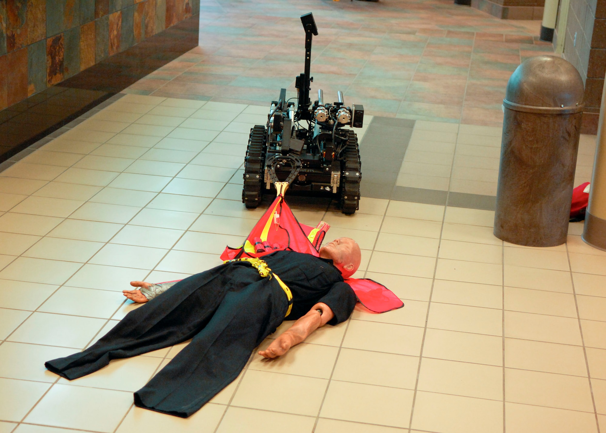 MINOT, N.D. -- An ICOR Caliber Robot operated by the Minot Police Department works on a simulated bomb at the Minot International Airport here June 4. The robot is equipped with multiple cameras and is wireless so it may be controlled from far distances. (U.S. Air Force photo by Senior Airman Ashley N. Avecilla)