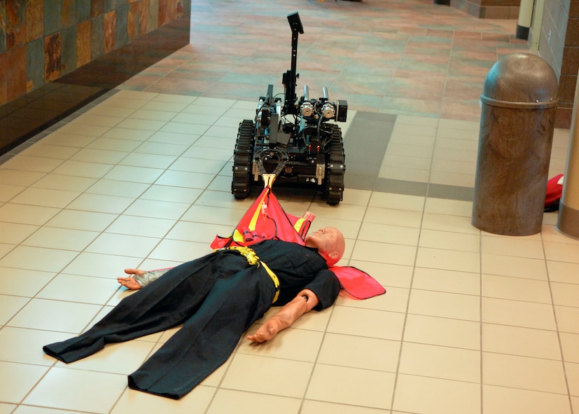 MINOT, N.D. -- An ICOR Caliber Robot operated by the Minot Police Department works on a simulated bomb at the Minot International Airport here June 4. The robot is equipped with multiple cameras and is wireless so it may be controlled from far distances. (U.S. Air Force photo by Senior Airman Ashley N. Avecilla)