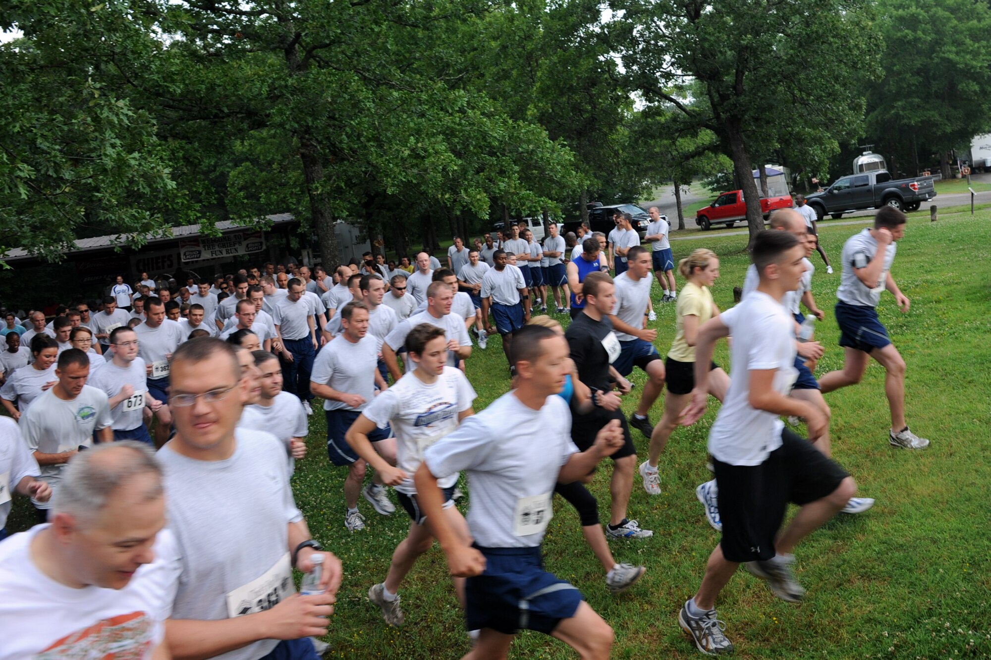 Team members of Little Rock Air Force Base sprint off the starting line June 4 during the Chief’s Group fun run at the small base lake. The Chief’s Group fun run is held to help raise money for the Chiefs Groups which they then turn around and put back into supporting team Little Rock. The run raised more than $4,000. (U.S. Air Force photo by Senior Airman Ethan Morgan)